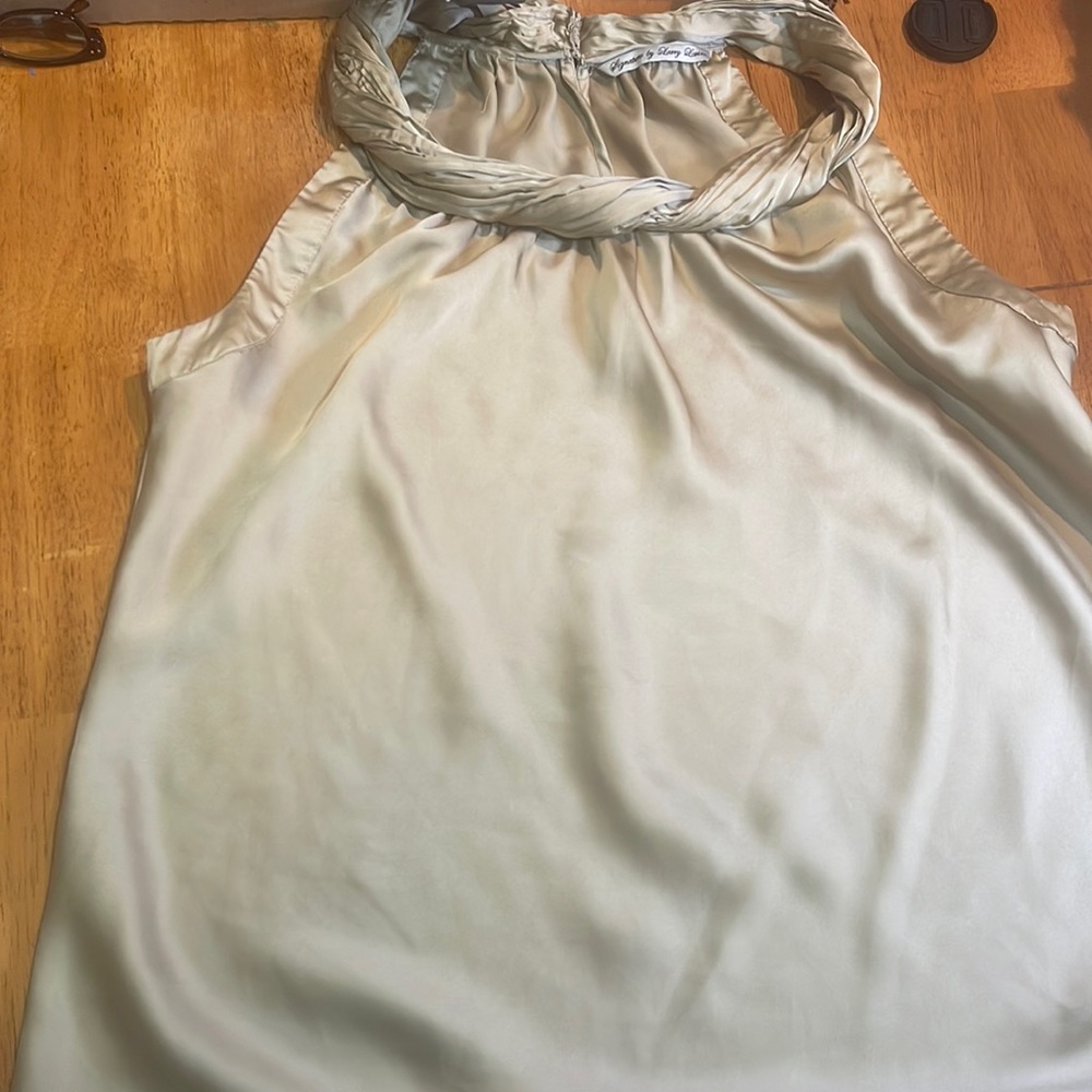 A silky  sleeveless blouse